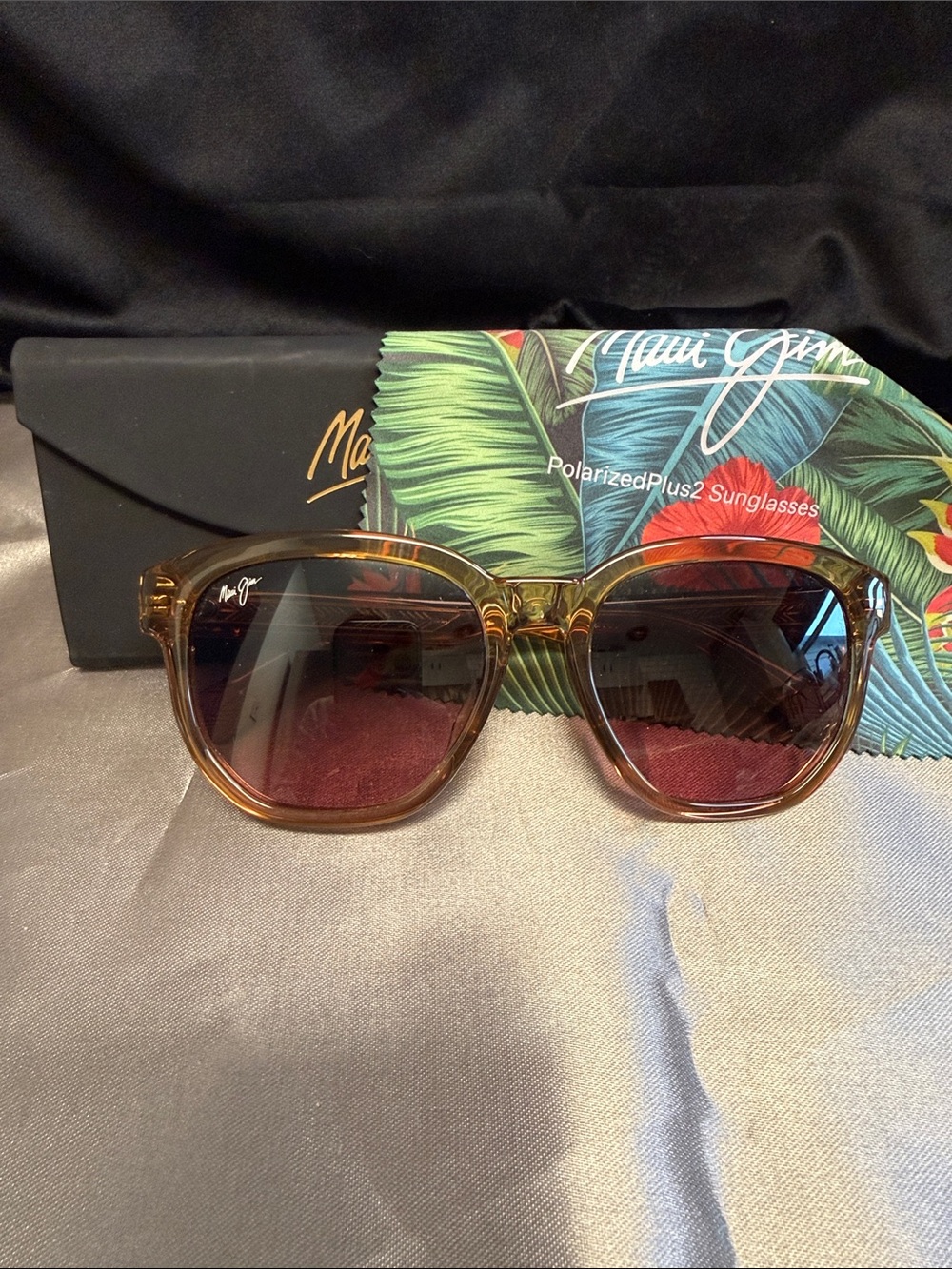Maui Jim Akahai polarized sunglasses in a shiny translucent light brown frame.